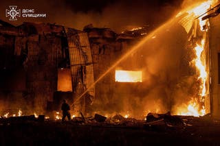 Sumy also came under attack on Tuesday. This picture shows a Ukrainian emergency worker in action after the attack on 18 August.